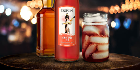 This Duplin Whiskey Sour cocktail gets mixed in a Mason jar