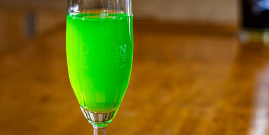 Melon liqueur adds a hint of green to the Du-Mosa Mimosa for St. Patrick's Day parties.